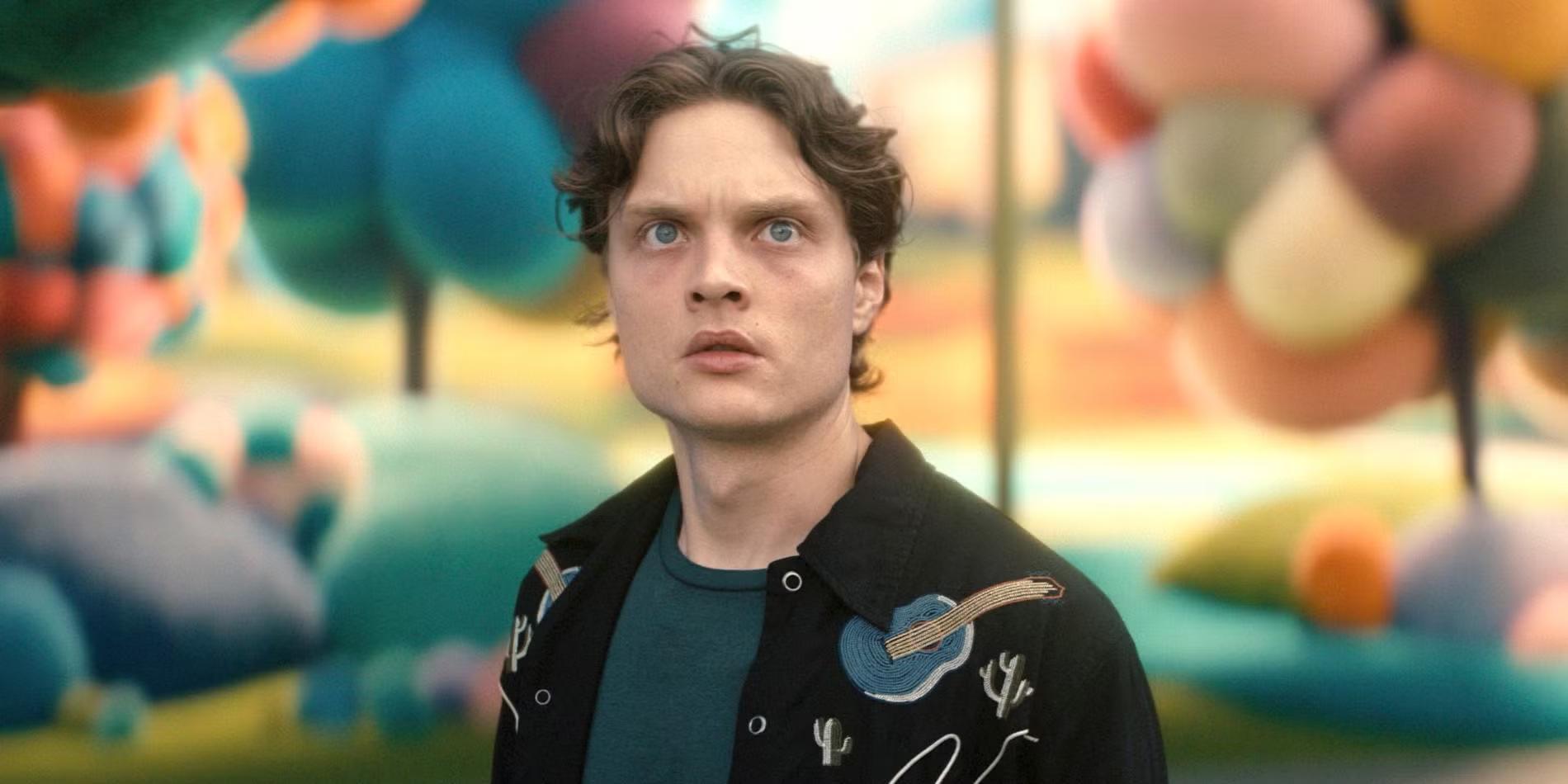 Sam (Asa Germann) looking surprised while standing in a colorful town in Gen V season 2. His story intertwines with Gen V Season 2 رستگاری Cate.