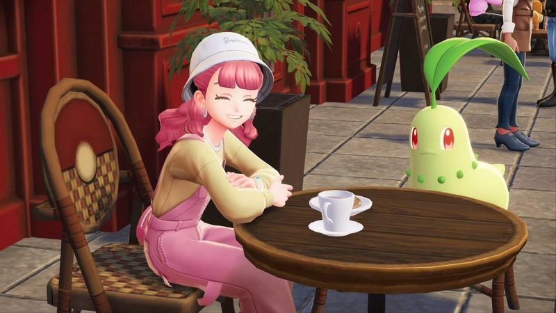 نکات بازی Pokemon Legends: Z-A: A trainer and a Chikorita sit outside a cafe.