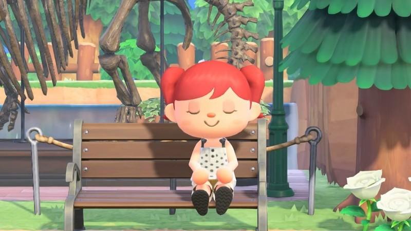یک اسکرین شات از یک روستایی که چشمانش بسته است و روی یک نیمکت نشسته، در تریلر معرفی Animal Crossing: New Horizons آپدیت 3.0 و Switch 2 Edition.