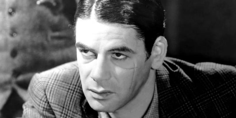 Paul Muni as Tony Camonte glowers in Scarface. سرنوشت مشترک The Godfather و Scarface