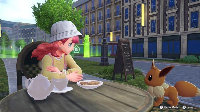 محل های Eevee در Pokemon Legends: Z-A: یک مربی کنار ایوی (Eevee) در کافه ای نشسته است.