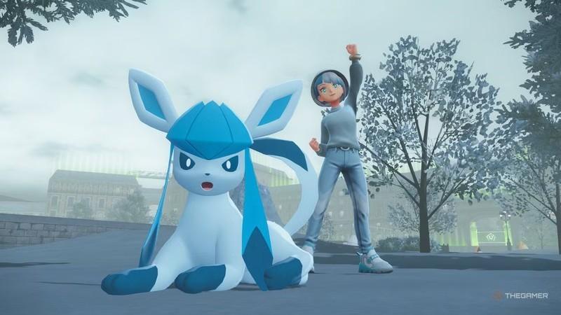 مربی که پشت Glaceon در بازی Pokemon Legends: Z-A با ست لباس Pokemon Legends: Z-A ژست گرفته است.