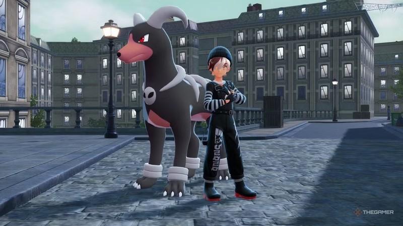 مربی که کنار Houndoom در بازی Pokemon Legends: Z-A با ست لباس Pokemon Legends: Z-A ژست گرفته است.