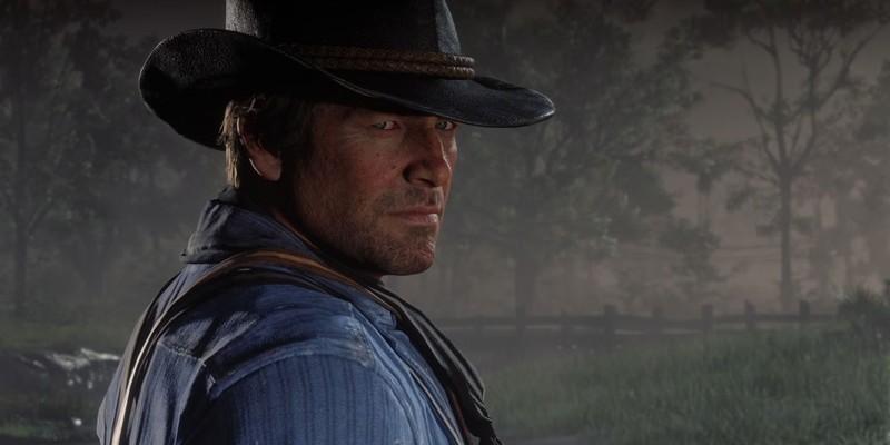 آرتور مورگان در حال نگاه کردن به دوربین در Red Dead Redemption 2. کشف تخفیف های پنهان PS Store.